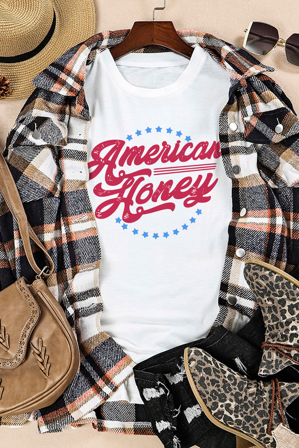 white t-shirt that says "American Honey" in red letters with little blue stars