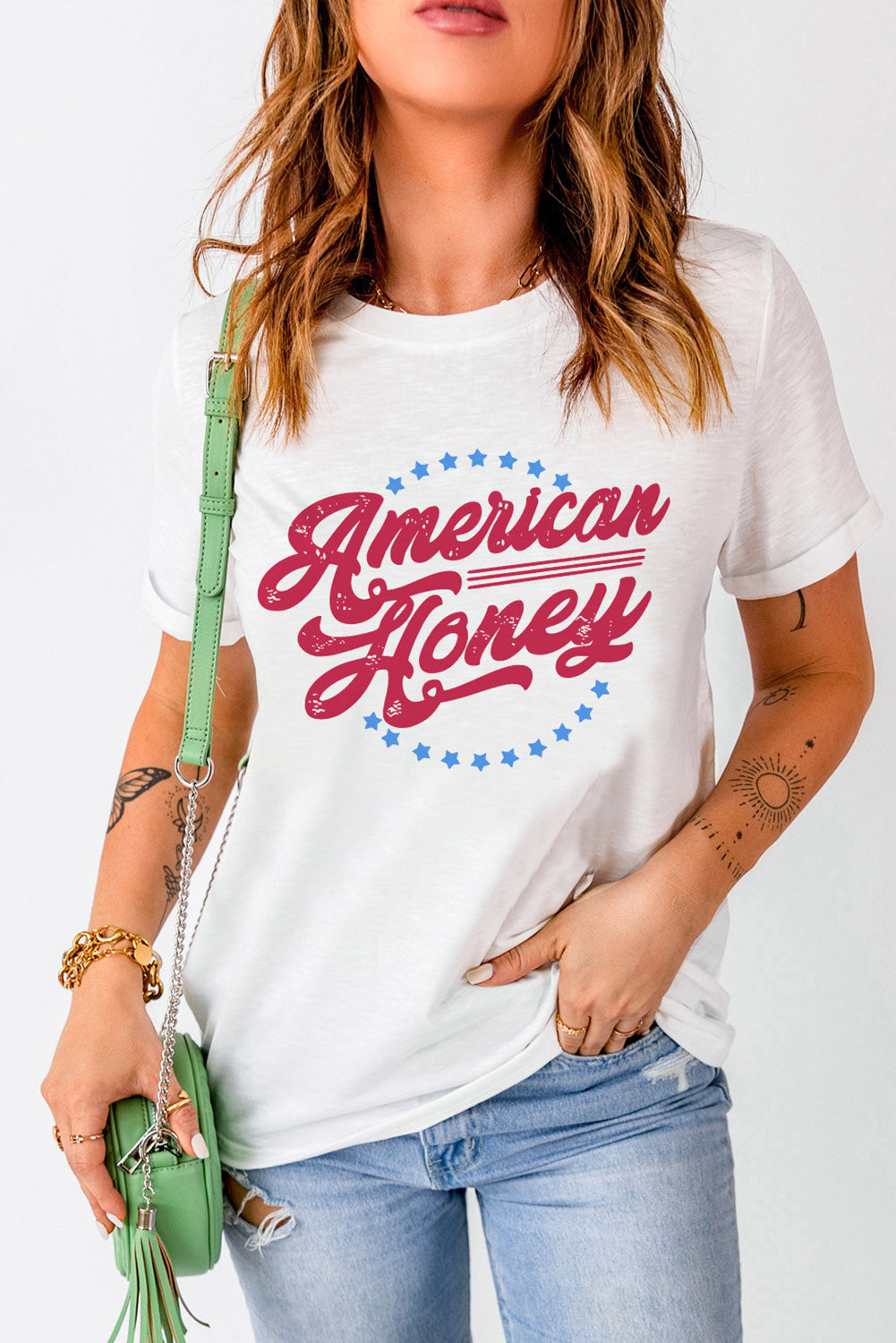 white tee with red letters, american honey saying, little blue stars aournd the letters